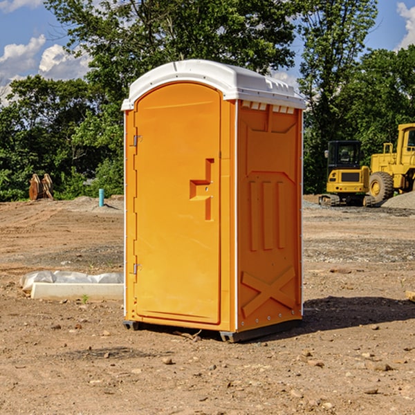 what is the cost difference between standard and deluxe porta potty rentals in Aguilar